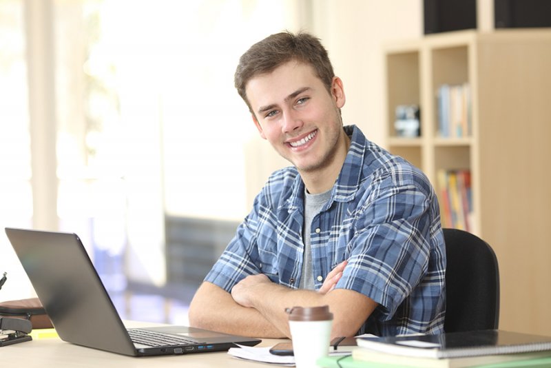 Young Man Studying in an Open Lounge